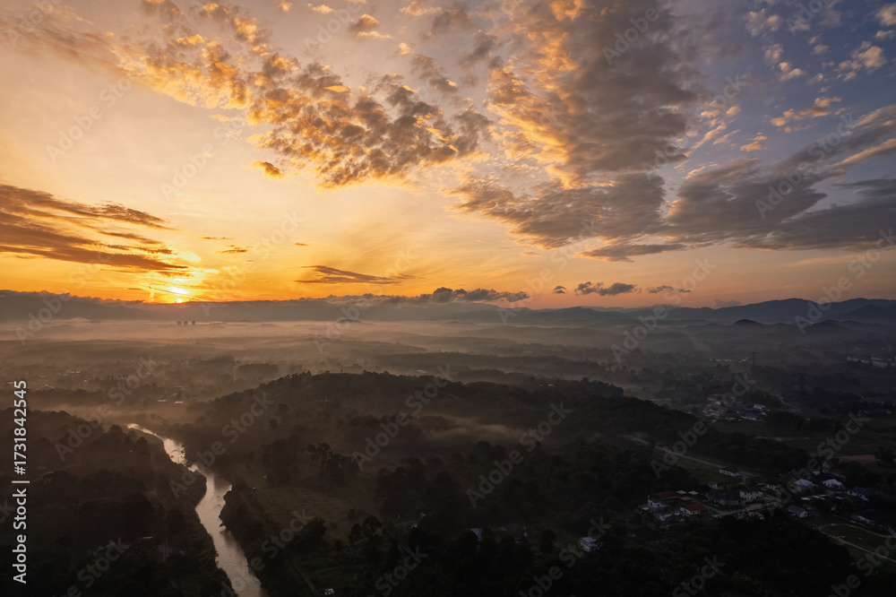 Obraz premium Golden sunrise aerial view in Bandar Seri Putra, Malaysia.