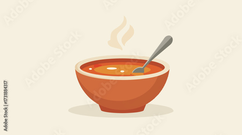 Hot soup in bowl with spoon