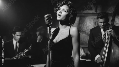 young woman singing into microphone