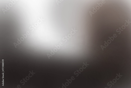 Brushed metal texture backdrop with a dramatic stage spotlight