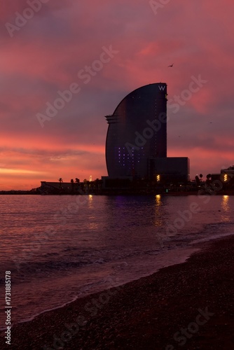 Photography Barcelona beach at sunrise with Hotel Vela.