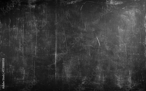 Dark gray gradient scratched grainy background. Black wall grunge background 