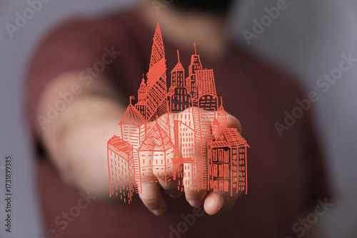 Hand holding a sketch of a ...