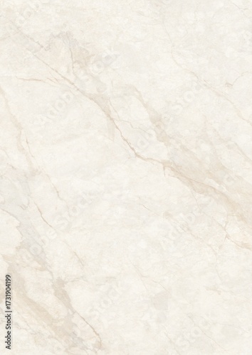 Close-up view of a light beige marble surface with natural veining patterns
