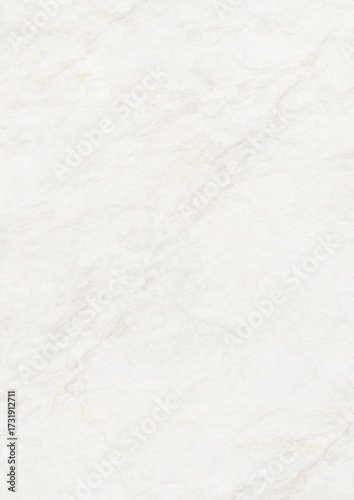 Close-up of white textured surface resembling marble or stone with subtle veining patterns
