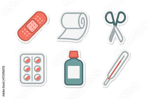 Essential medical and first aid supplies including adhesive bandage, gauze, scissors, pills, medicine bottle, and thermometer for healthcare concepts