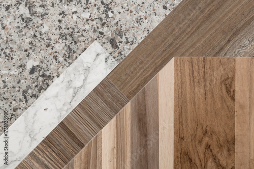 Detailed look at a variety of interior material samples such as granite, terrazzo, vinyl wood flooring, stainless steel, quartz, wallpaper, and engineered wood tiles palette