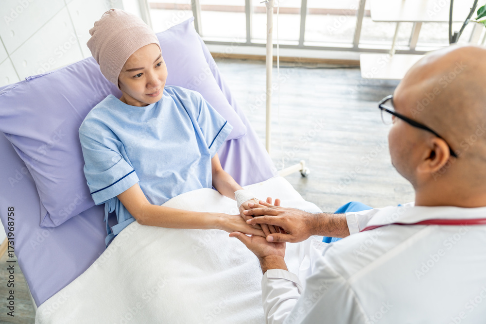 Obraz premium Male doctor visiting female cancer patient with care and compassion in hospital room. Oncology support medical consultation healthcare and hope. Doctor reporting medical test results to the patient