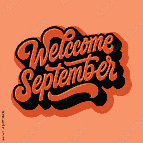 A stylish salmon and black script design welcoming the month September.
