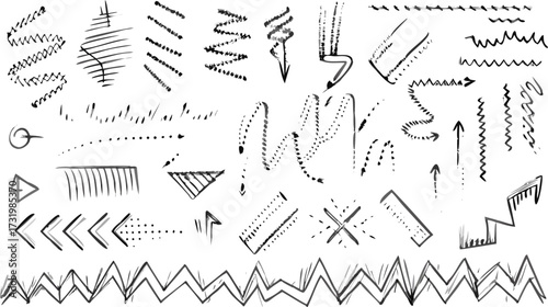 Assorted black and white hand drawn arrows zigzags and lines in various styles and orientations on white