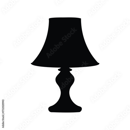 Silhouette of a traditional lamp with a shade sitting on a table