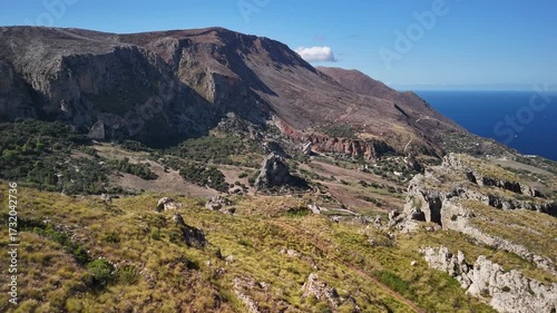 Scenic aerial view of hills and Mediterranean Sea in Sicily, Italy