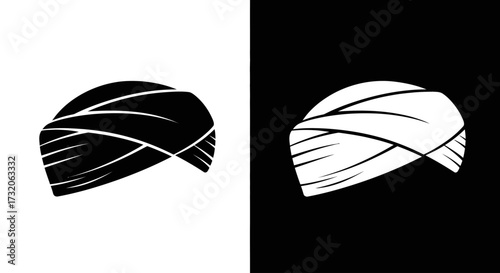 A graphic illustration of a traditional wrapped turban, shown as a black icon on white and a white icon on black.