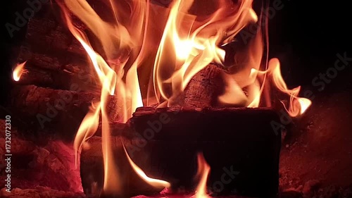 fire burns at night in a fire pit