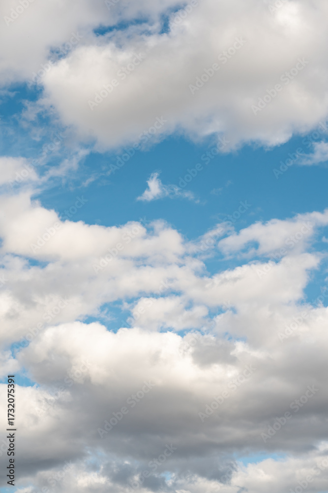 Fototapeta premium Vivid Blue Sky with Fluffy White Clouds