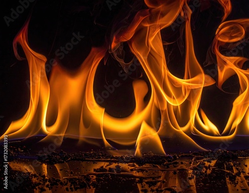 Fiery flames dancing against a dark background