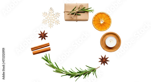 Isolated aromatic Christmas composition of gift box, dried orange slice and winter spices