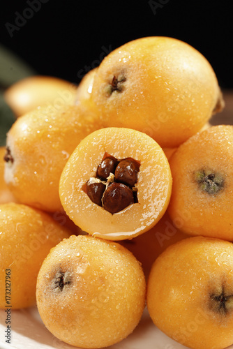 Fresh Loquat Fruits from Mengzi Panzhihua China with Water Droplets Cross Section View