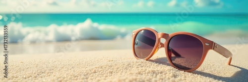 Stylish sunglasses on a vibrant summer beach scene Perfect for travel, vacation, and summer holiday promotions Enjoy the sunny days!, travel, fun