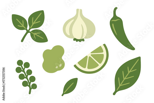 Assortment of fresh cooking ingredients including basil leaves, garlic, chili pepper, lime wedge, and green peppercorns