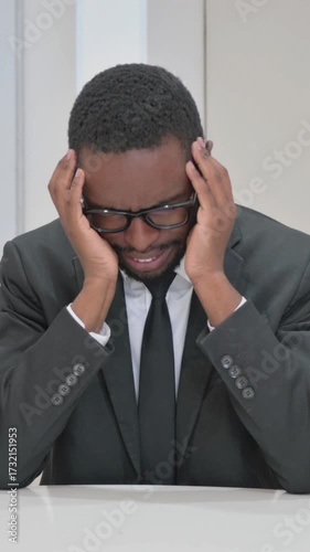 Angry Young Businessman at Office Desk