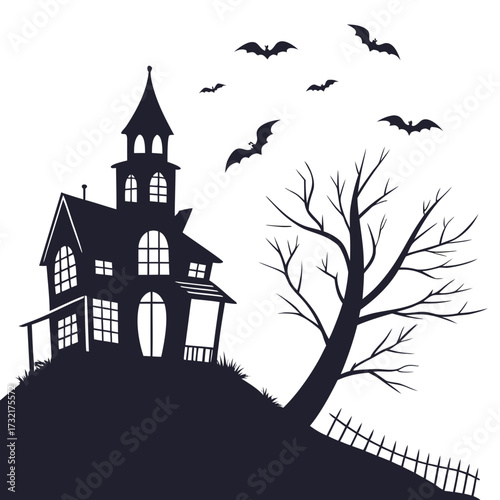 Silhouette of a spooky haunted house with bats