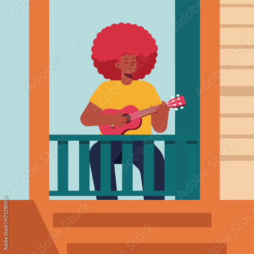 Woman with afro playing ukulele on balcony