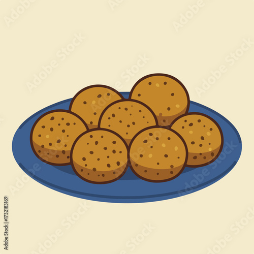 Plate of cookies with chocolate chips on a cream background