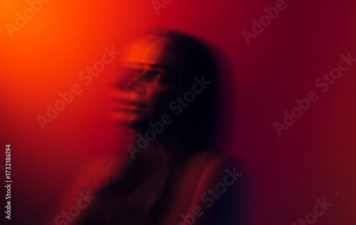 brunette portrait in Red color  with blurry long exposure technique 