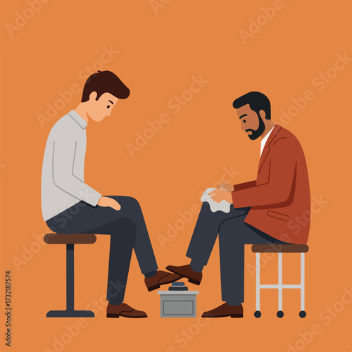 Man getting shoe shine from another seated on a stool, orange background