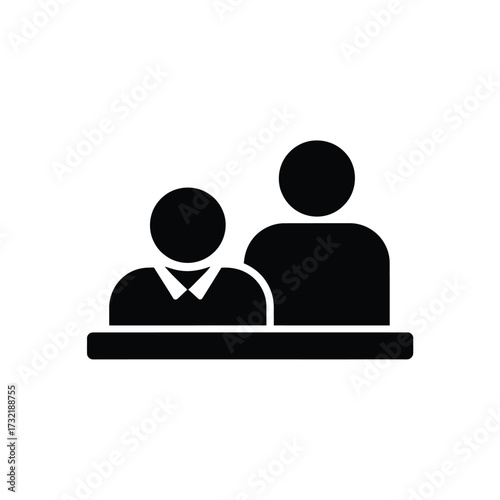 Two people sitting behind a table or counter icon