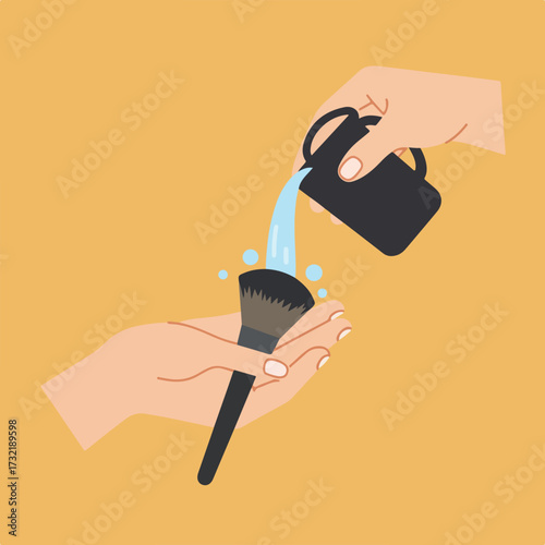 Hands washing a makeup brush with water from a mug