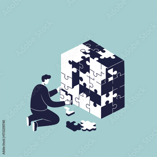 Person kneels assembling a large puzzle cube, incomplete, on pale blue