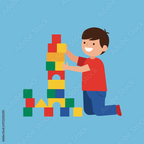 A boy builds tower of multicolored blocks on a blue background, smiling widely