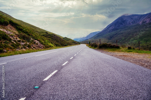 Empty country road through a valley, Scotland
