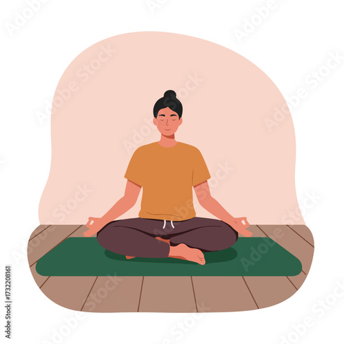 Person in lotus position on green mat in tranquil setting, eyes closed