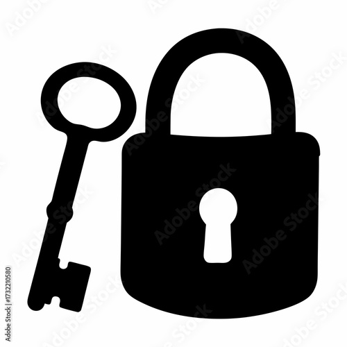 Vintage key resting next to a black padlock, representing security concept