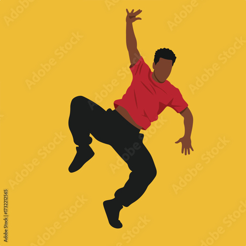 Silhouette of a dancer mid-pose against a yellow backdrop