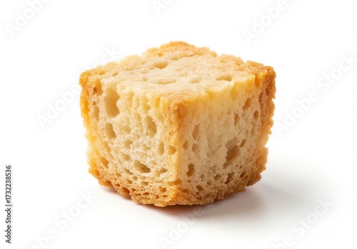 A single, perfectly toasted crouton cube with a golden-brown crust and a visible porous interior. Isolated white background.