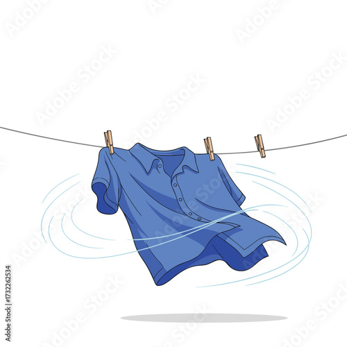 A blue shirt drying on a clothesline in the wind.