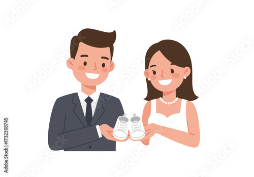 A couple smiling holding baby shoes The man is wearing a suit and the woman is wearing a dress and a necklace