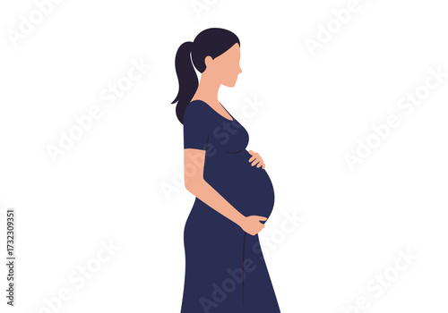 A pregnant woman in a dark blue dress stands her hands gently cradling her baby bump