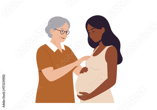 An older woman touches the belly of a pregnant black woman