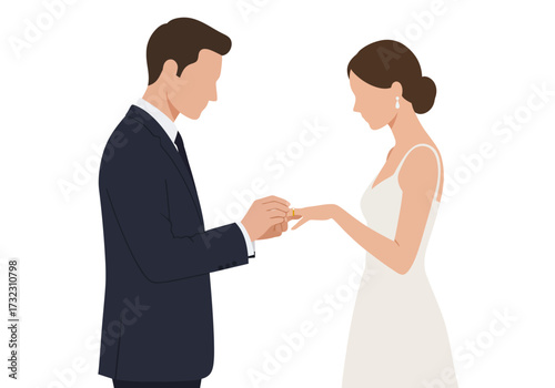Faceless groom puts gold ring on brides finger at wedding