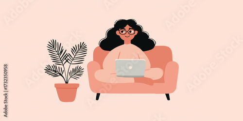 A relaxed individual in a comfy setting is deeply focused on their computer while a lush plant adds a touch of natural elegance.