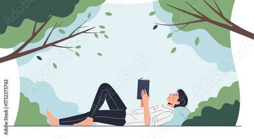 A young man peacefully reading a book while relaxing under the shade of a tree in nature