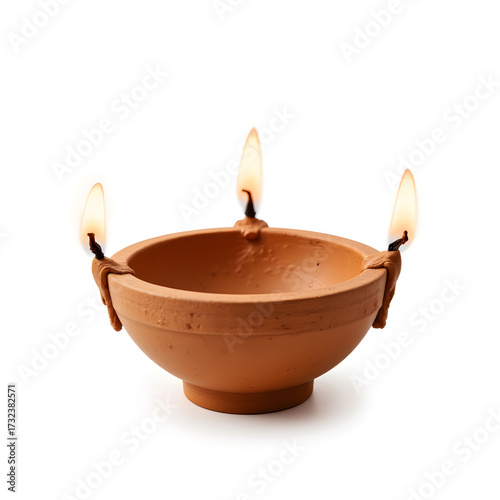 Diya lamp with three wicks glowing, symbolizing light and hope
