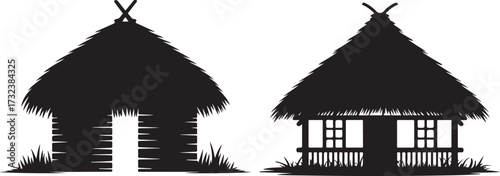 Silhouettes of two traditional thatched roof huts.