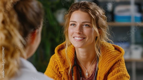 Doctor and patient smiling during a consultation in a medical office in the afternoon light