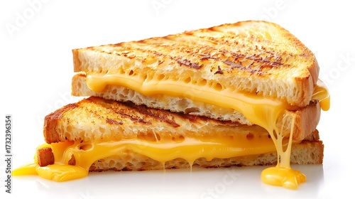 A close up shot of two grilled cheese sandwiches stacked on top of each other with melted cheese dripping